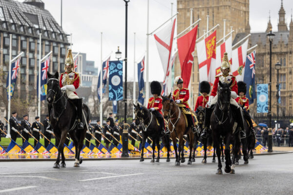 The UK Armed Forces conduct their largest ceremonial operation for 70 years today (06/05/2023), and accompanied Their Majesties King Charles III and Queen Consort Camilla to the Coronation service at Westminster Abbey. The Household Cavalry traditionally provide escorts to accompany the Sovereign when they travel by road, with the tradition dating back to the reign of King Charles II. The Major General’s Retinue were the first to step off, providing ceremonial conformation that the way ahead was set and secure, also known as ‘proving the route’. Ten minutes later, The King’s Procession got underway, led by the Household Cavalry Mounted Band. Around 200 troops from the Household Cavalry escorted Their Majesties in the Diamond Jubilee Coach as they travelled the 1.42 miles from Buckingham Palace to Westminster Abbey, covering the London landmarks of Buckingham Palace, The Mall, Admiralty Arch, Trafalgar Square, Whitehall, Parliament Square and Westminster Abbey. The Diamond Jubilee Coach travelled in between the Sovereign’s Escort, comprising two divisions from the Blues and Royals in front and two divisions from the Life Guards riding behind. During the Procession, the Mounted Band played a programme of music including Namur, Golden Spurs, Bravura, By Land and Sea, Boots and Saddles, and Coburg.